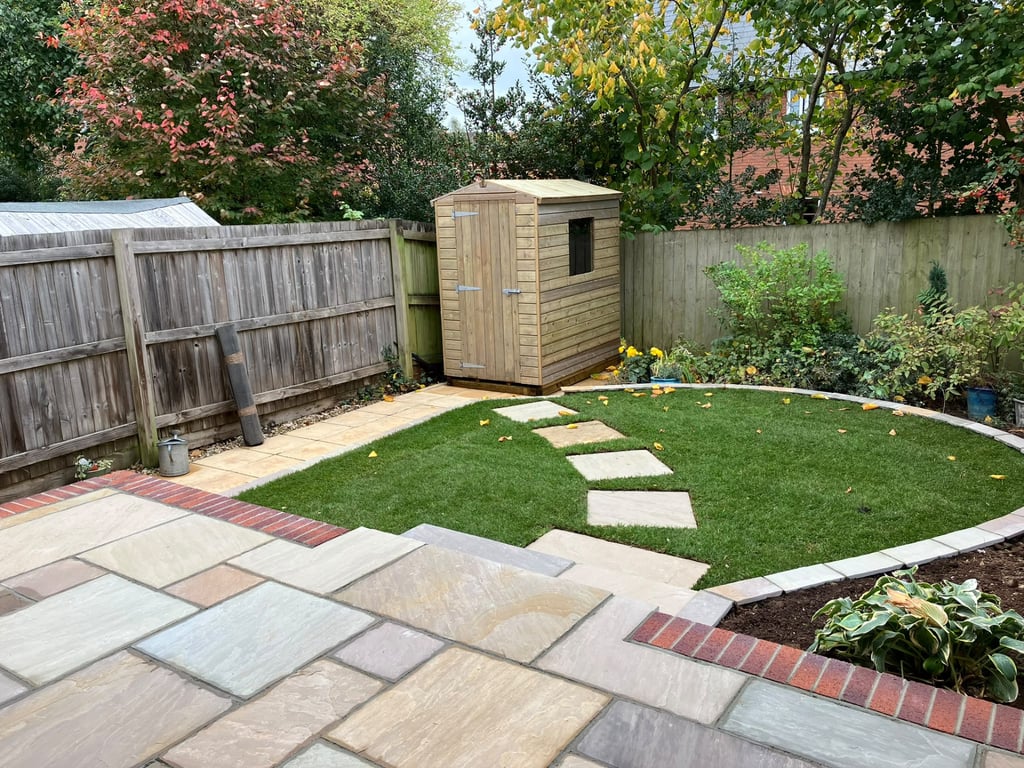 Patio laid by PC Landscaping at a home in South Devon, with level paving and a clean edge to the lawn
