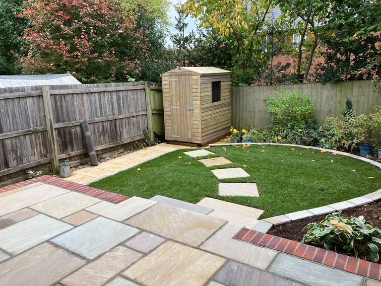 Patio laid by PC Landscaping at a home in South Devon, with level paving and a clean edge to the lawn
