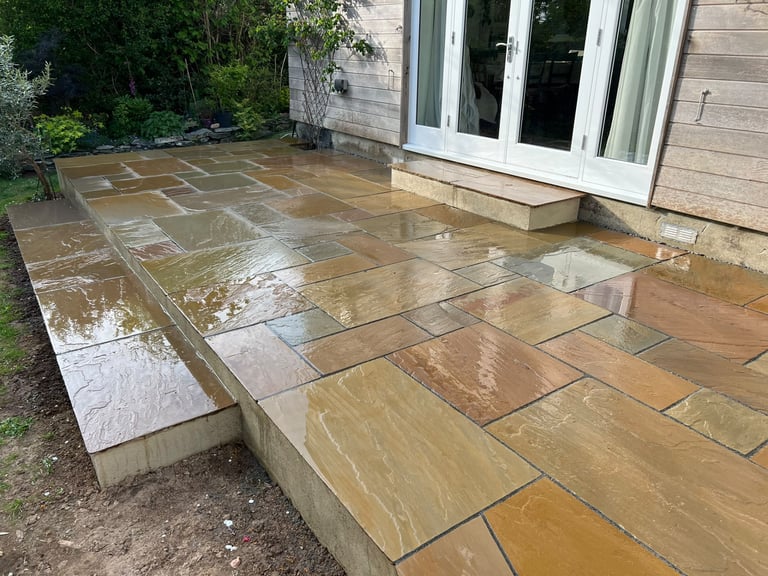 Indian sandstone patio laid by PC Landscaping in a South Devon garden