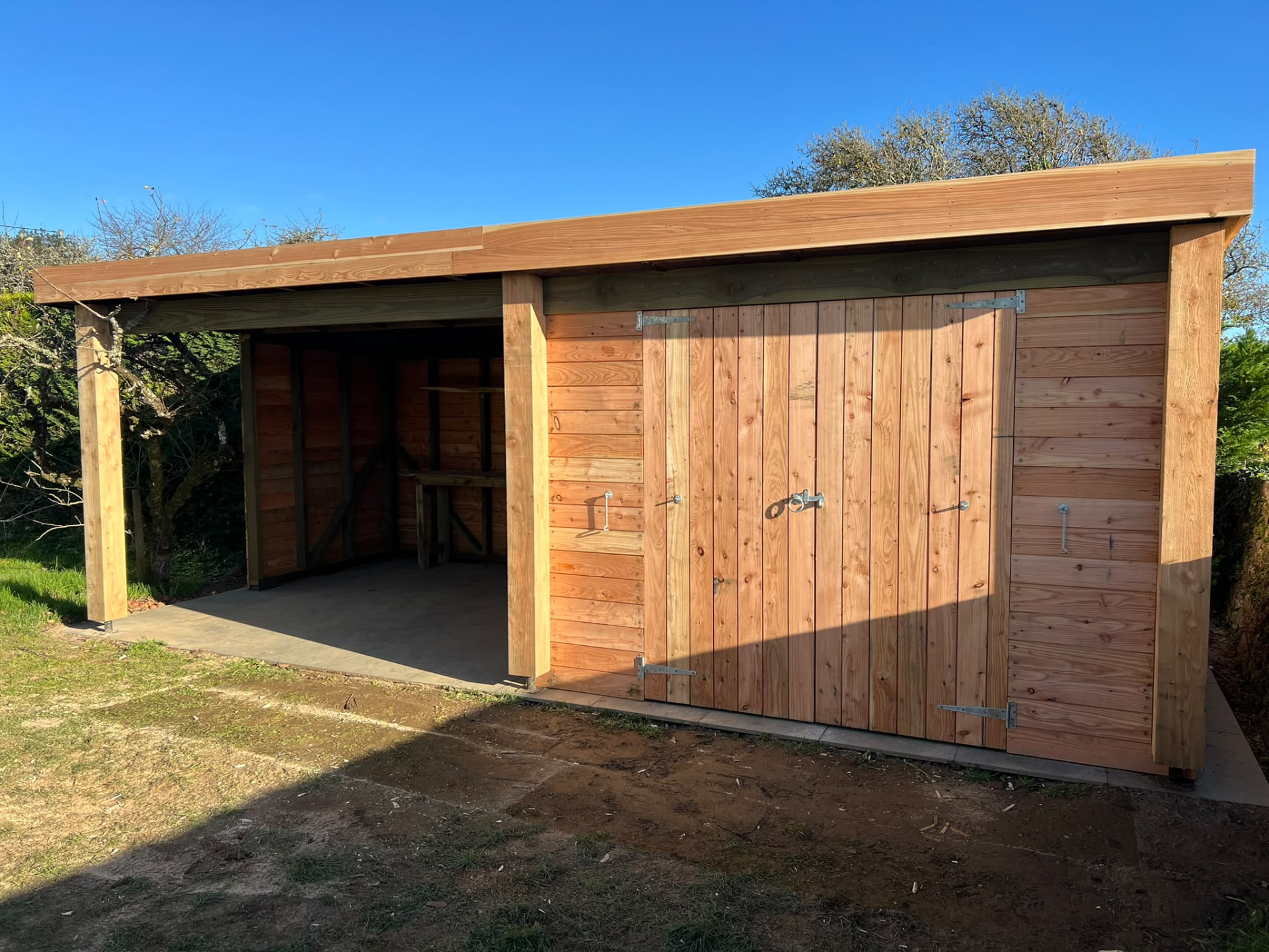 Timber-clad garden room built by PC Landscaping in a South Devon garden